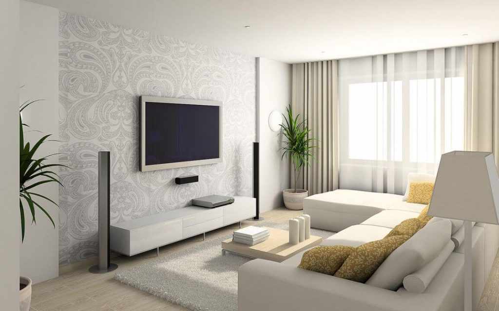 Белый угловой диван в интерьере гостиной