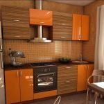 Деревянная оранжевая мебель на кухне